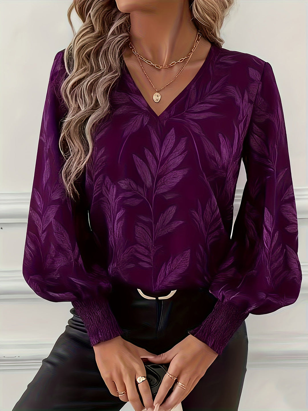 Blusa de mulher com decote em V e mangas balão